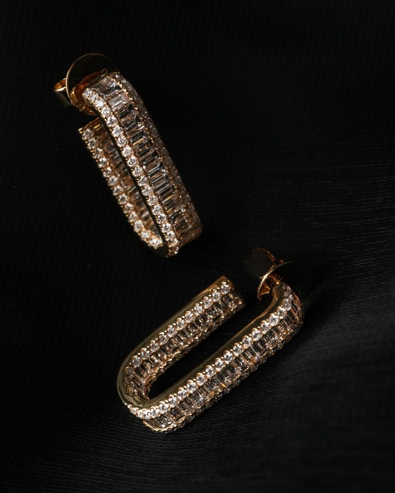 18k yellow gold baguette and round brilliant cut diamond earrings with a stud back
